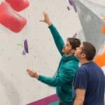Two men about to boulder on a wall